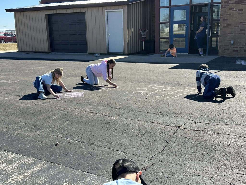 Students using chalk to draw math problems