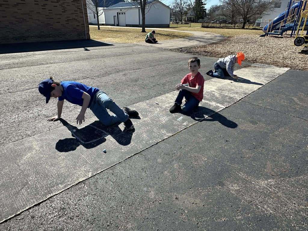 Students using chalk to draw math problems