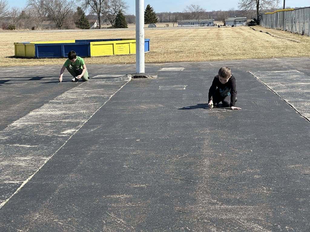 Students using chalk to draw math problems