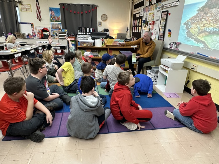 students with a guest reader 