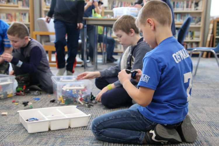 students playing with Legos