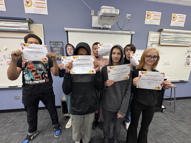 students holding certificates