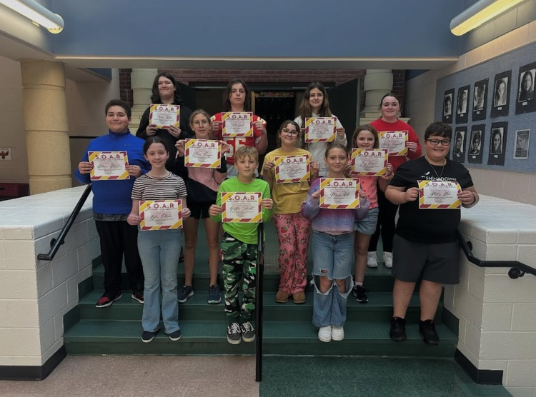 students holding certificates