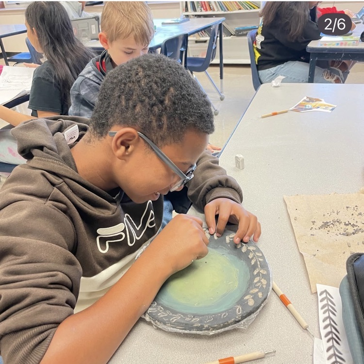 student working in art project