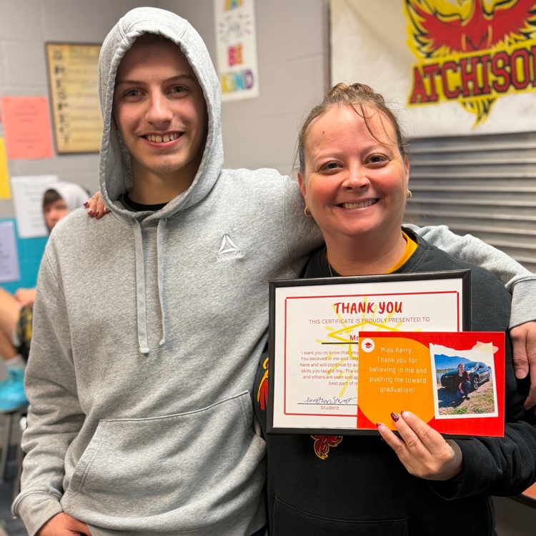 two people with an award