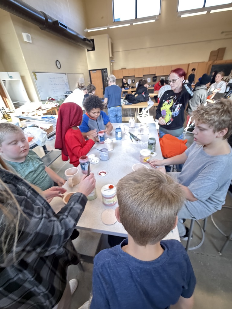 students making ceramic mugs