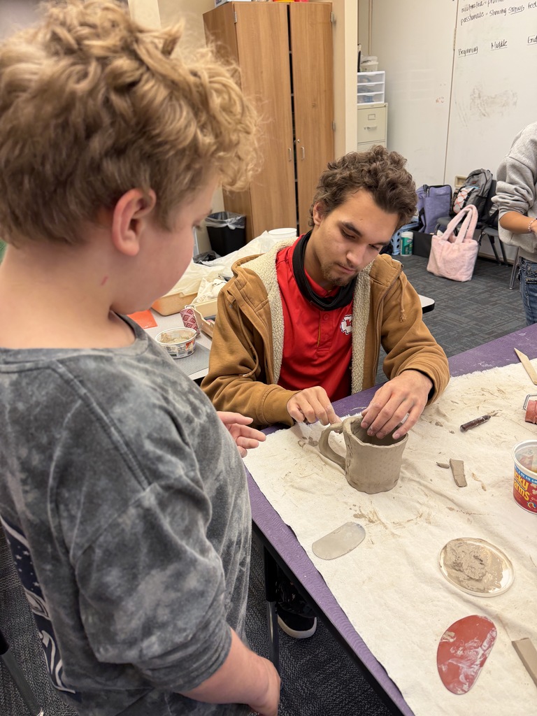 students making ceramic mugs