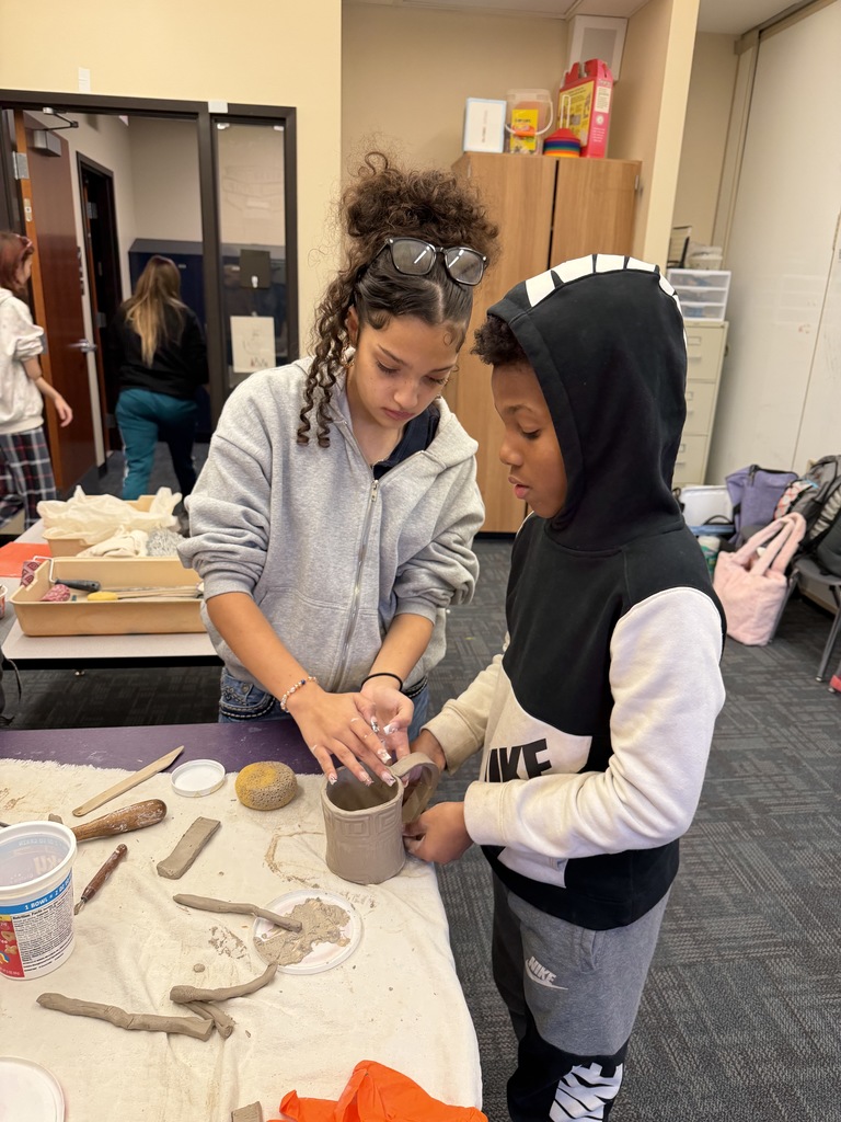 students making ceramic mugs