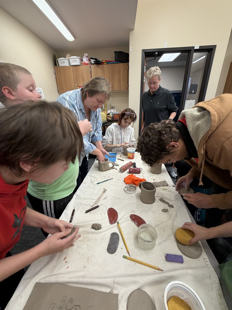 students making ceramic mugs