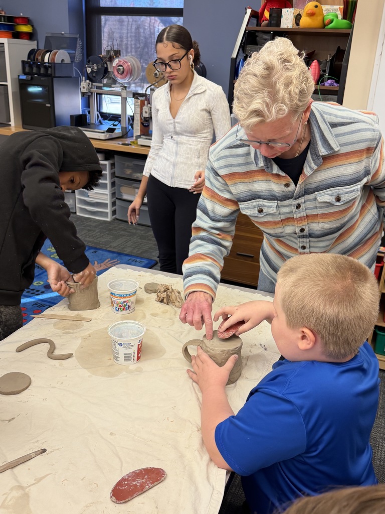 students making ceramic mugs