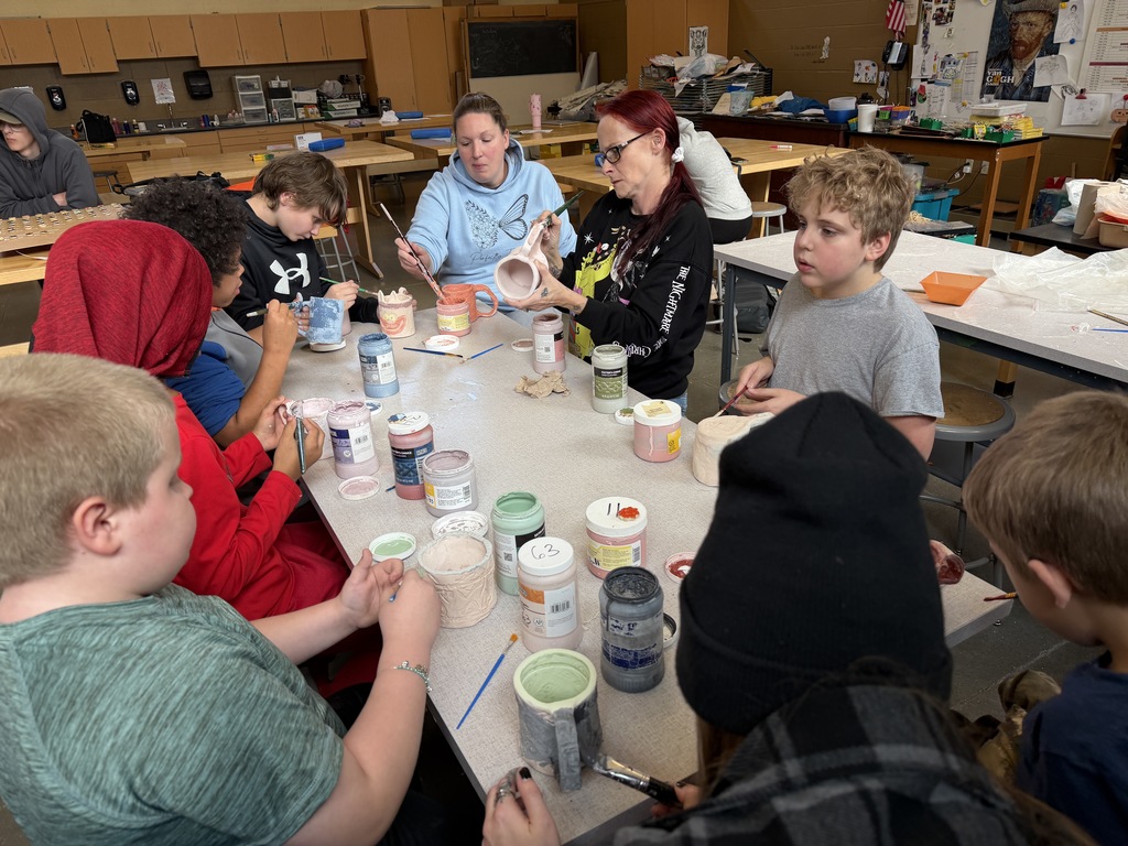 students making ceramic mugs