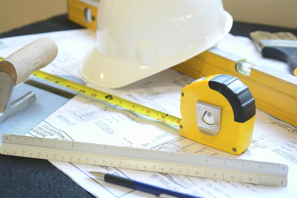 blueprint with hard hat
