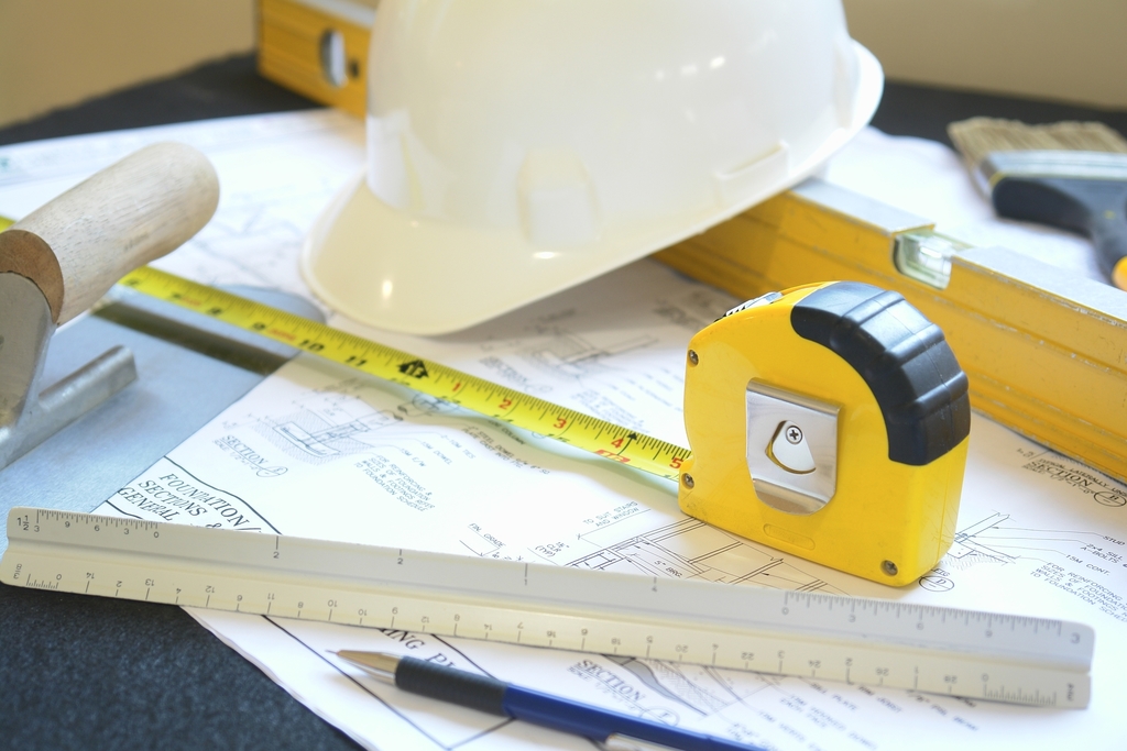 blueprints and hard hat