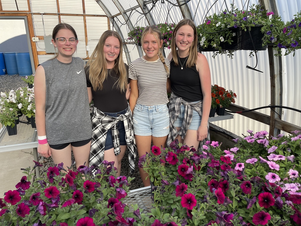 high school girls in greenhouse