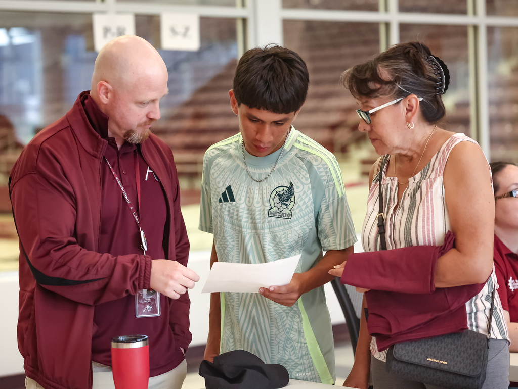 teacher helping students