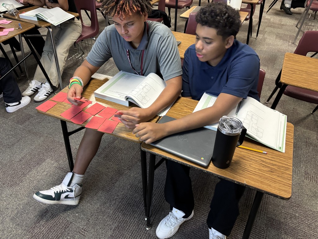 Students working in Ms. Sneed's Algebra 1 classes sorting cards.