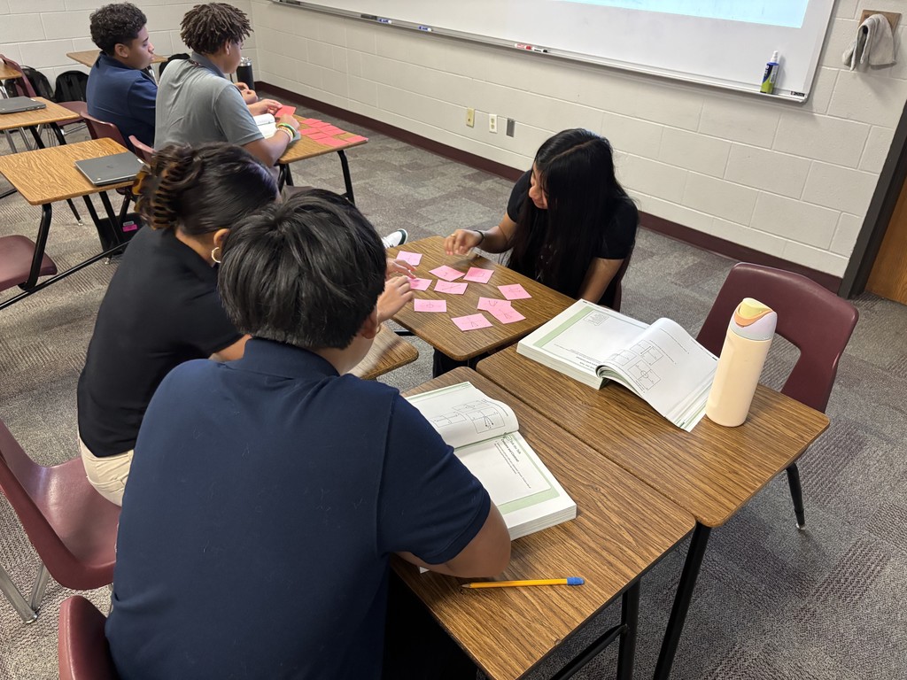 Students working in Ms. Sneed's Algebra 1 classes sorting cards.