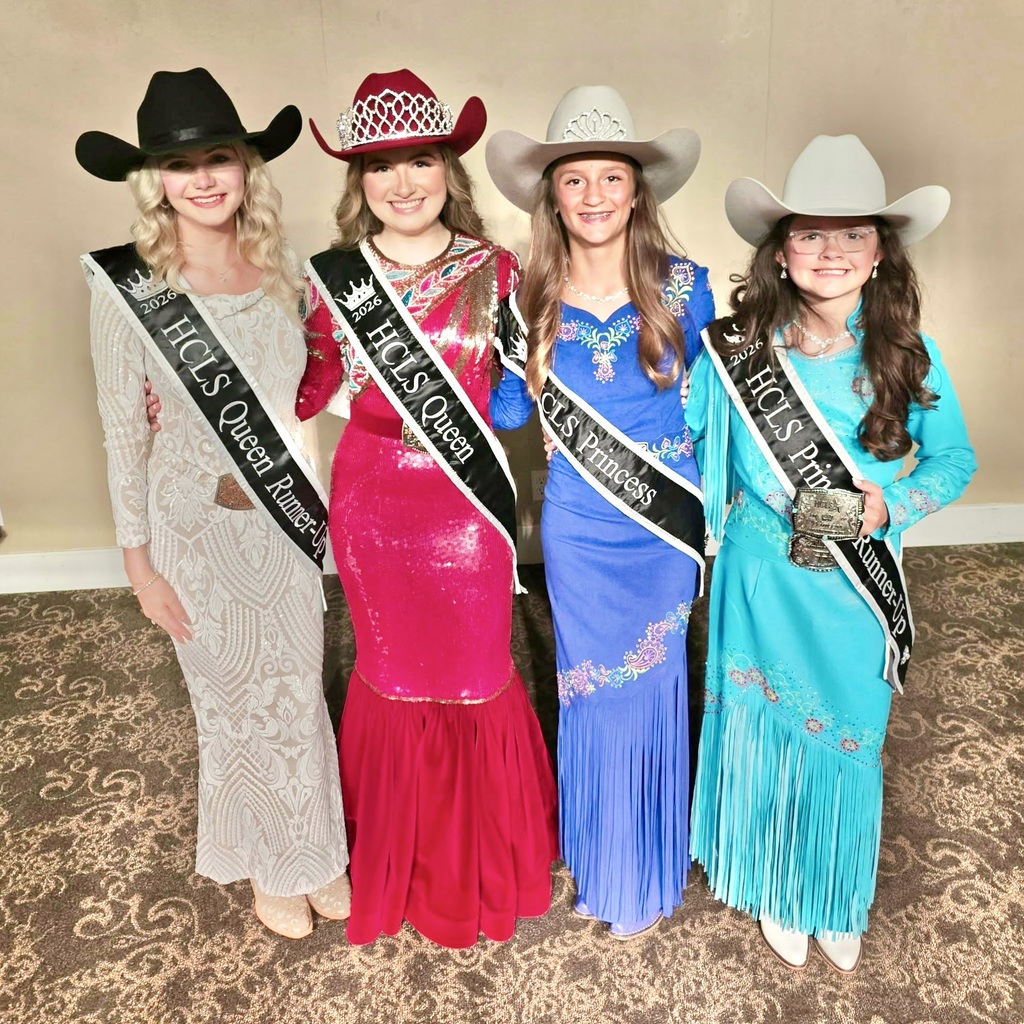 Photo of four young ladies, all dressed formally, wearing cowboy hats and sashes.