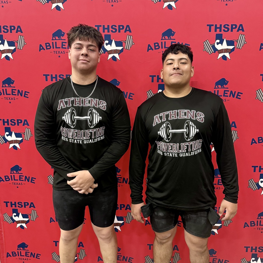 Two Athens High School powerlifters stand in front of a red THSPA Abilene backdrop, wearing black “Athens Powerlifting State Qualifiers” shirts and competition gear after competing at the state meet.