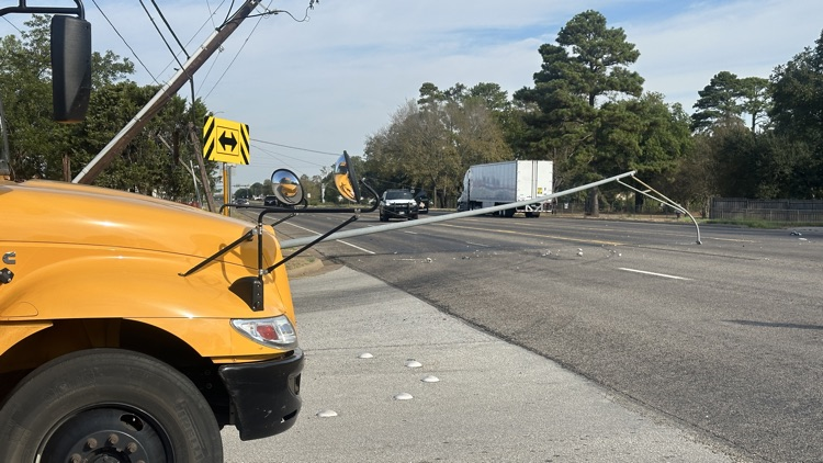 Photo of a bus and a downed powerline