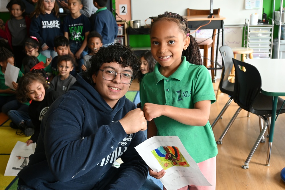 two students fist bump