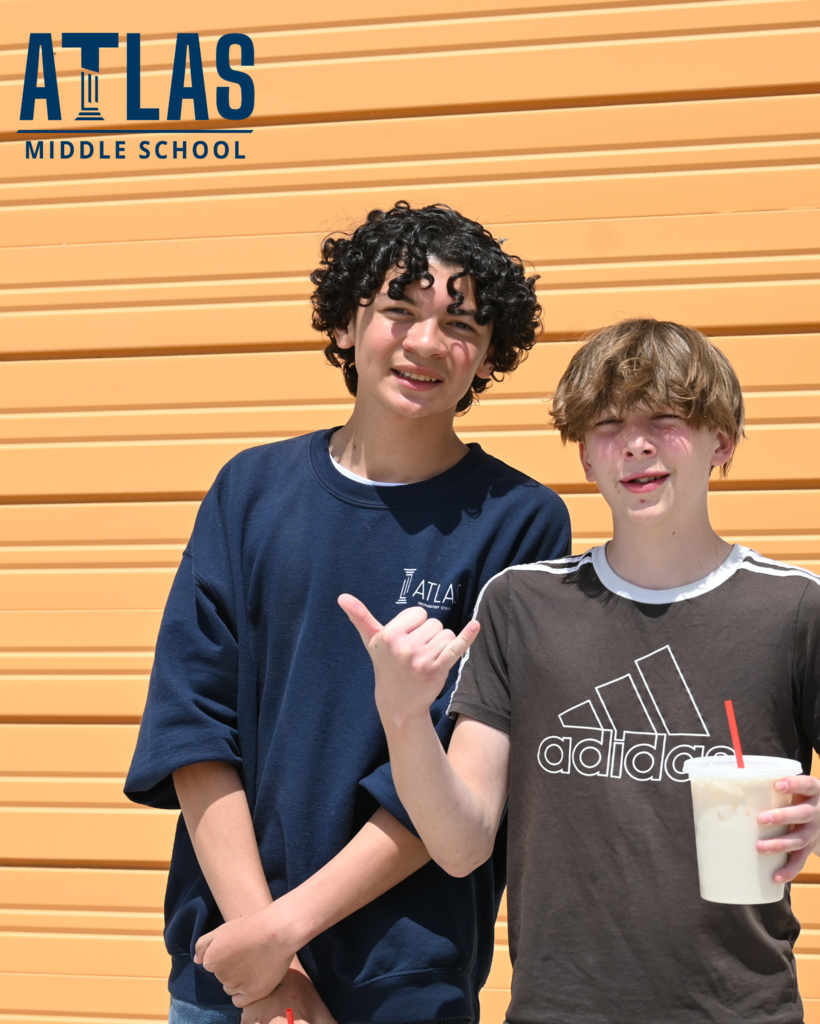 Students smile with drinks in their hands