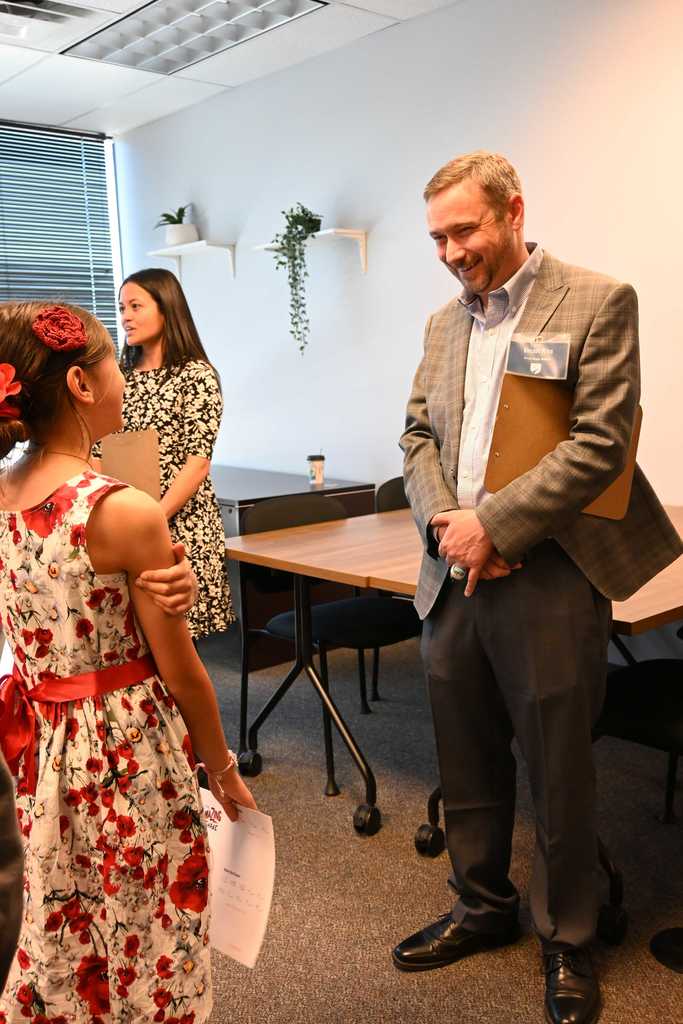 student talks with professional