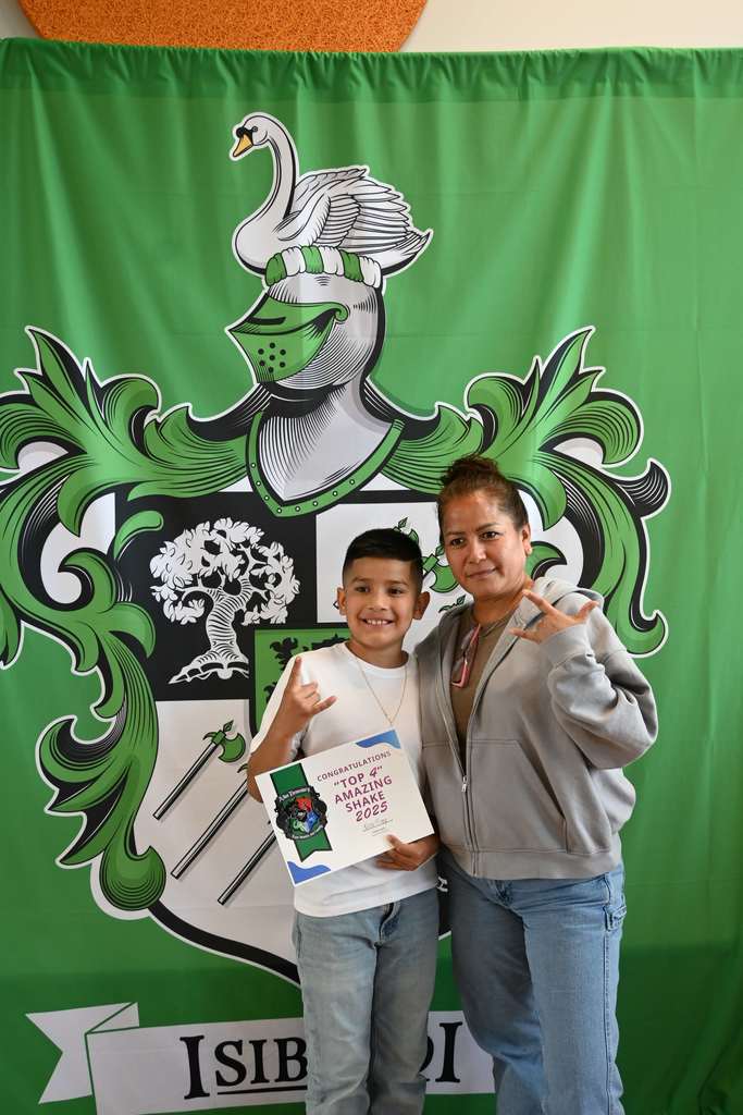 student smiles with parent