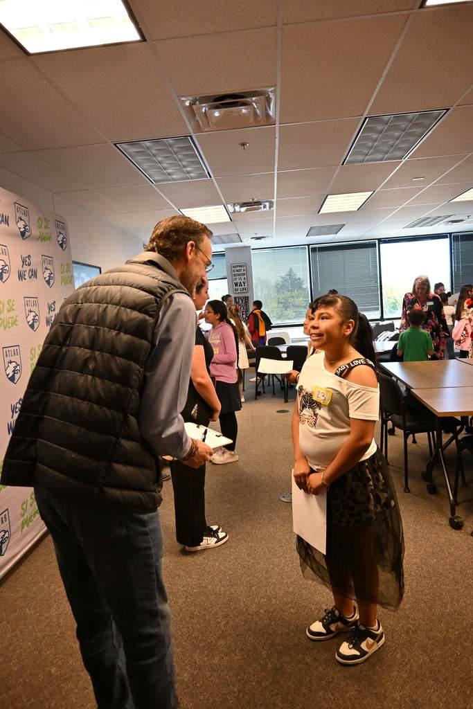 student talks with professional