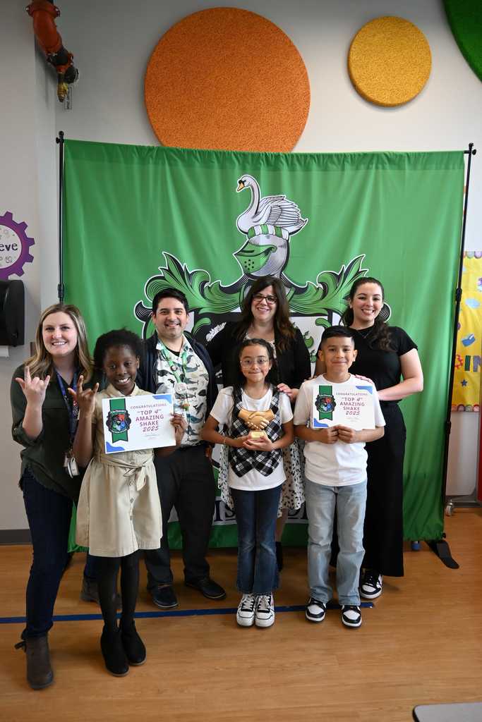 students smiles with teachers