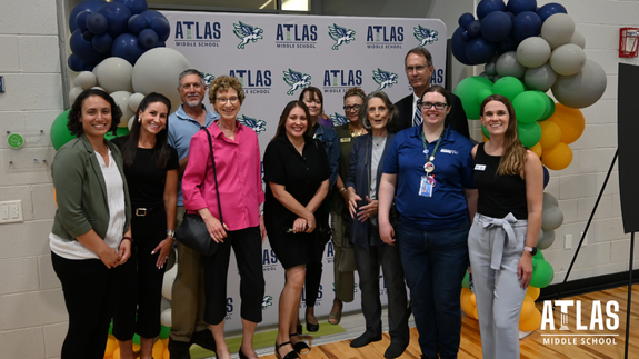 Donors smile for ribbon cutting