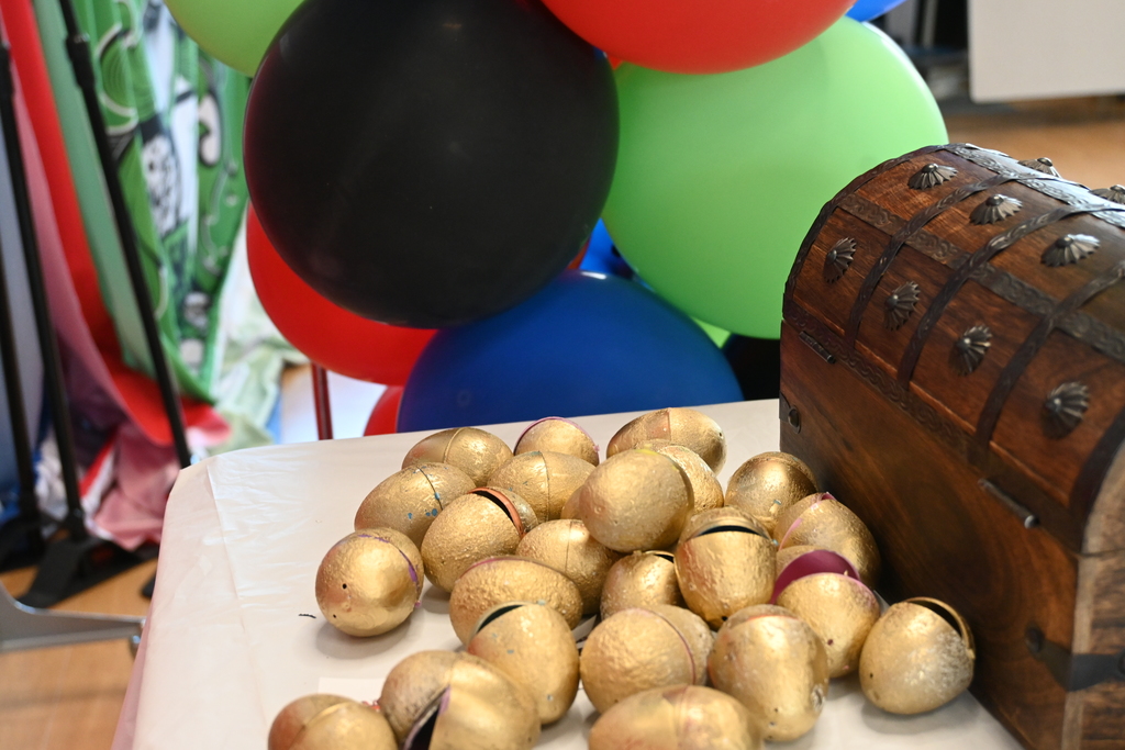 golden eggs with treasure box and balloons