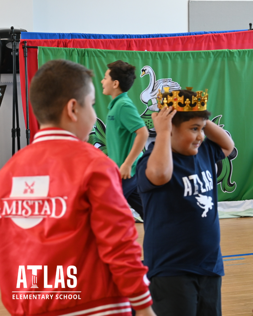 student places crown on head