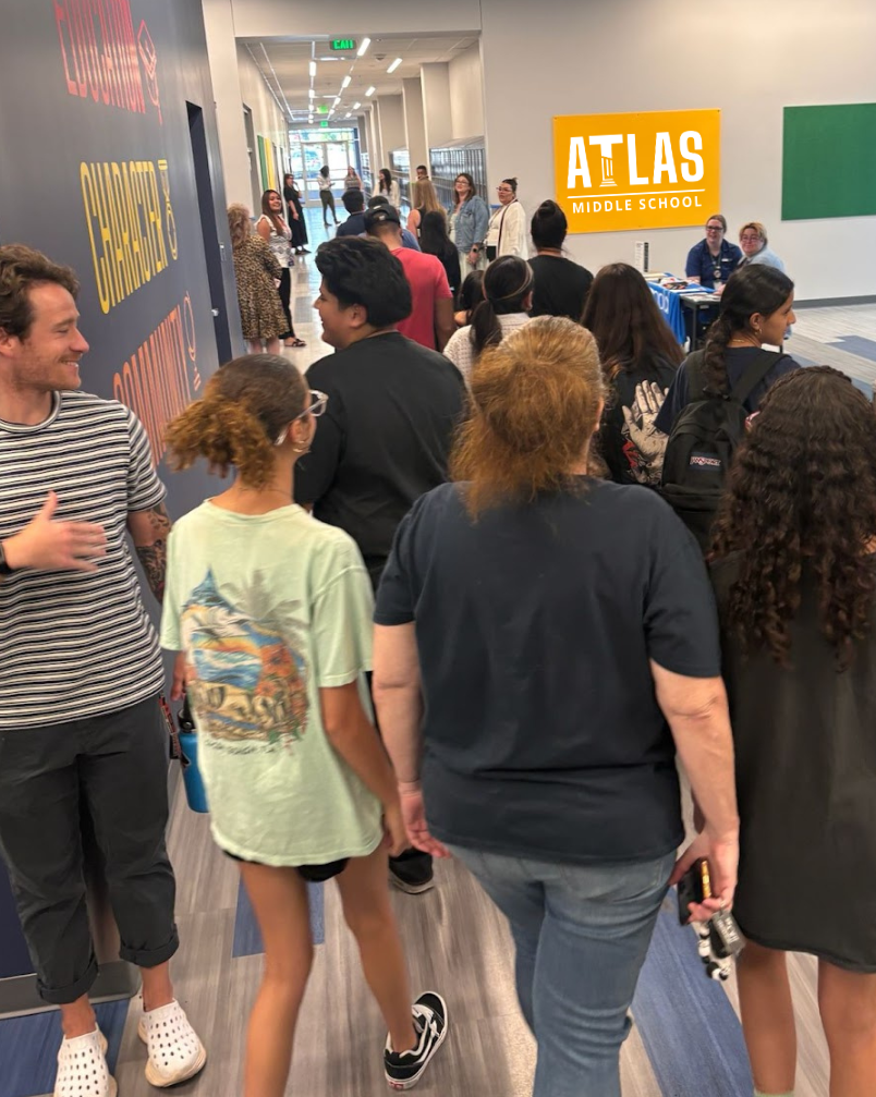 students walk the halls at atlas middle school