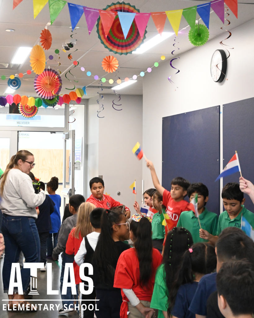 Atlas School logo with students and teachers celebrating the elementary schools house rally.