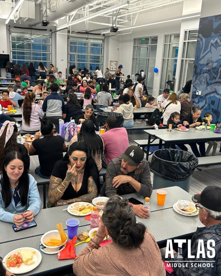 Cafeteria full of people enjoying food