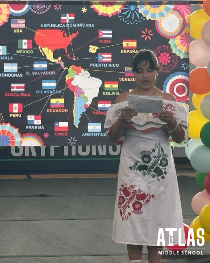 girl dressed in hispanic costume presents