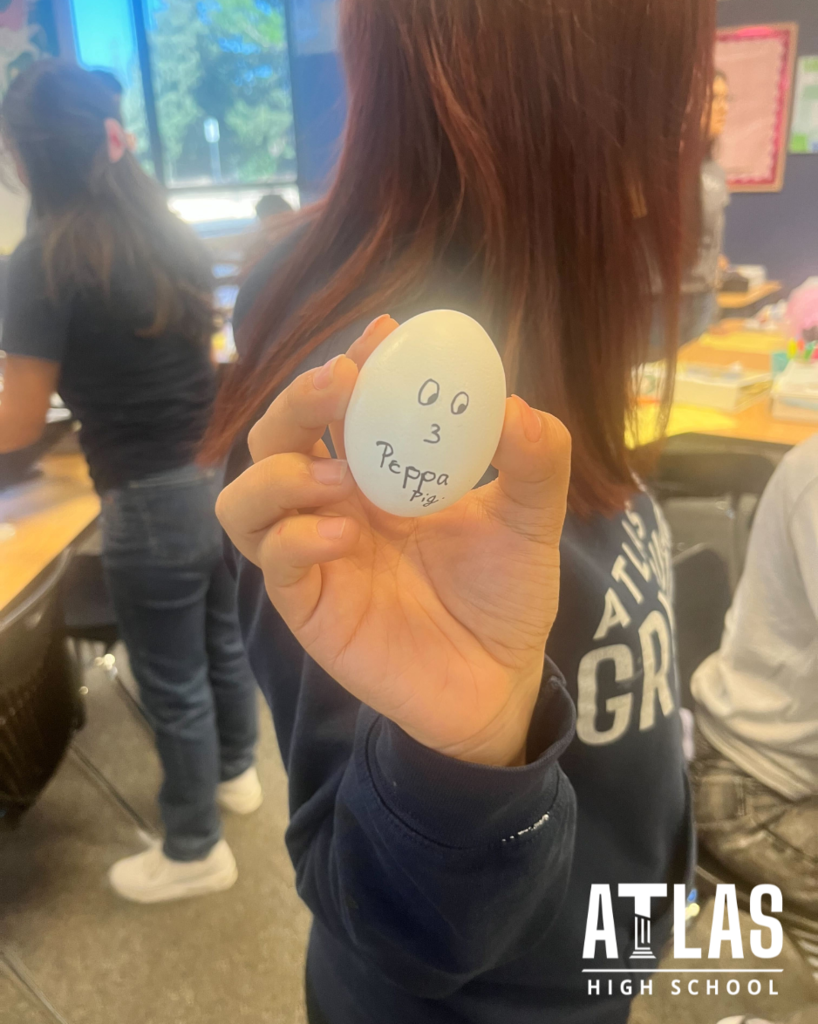 student holds egg
