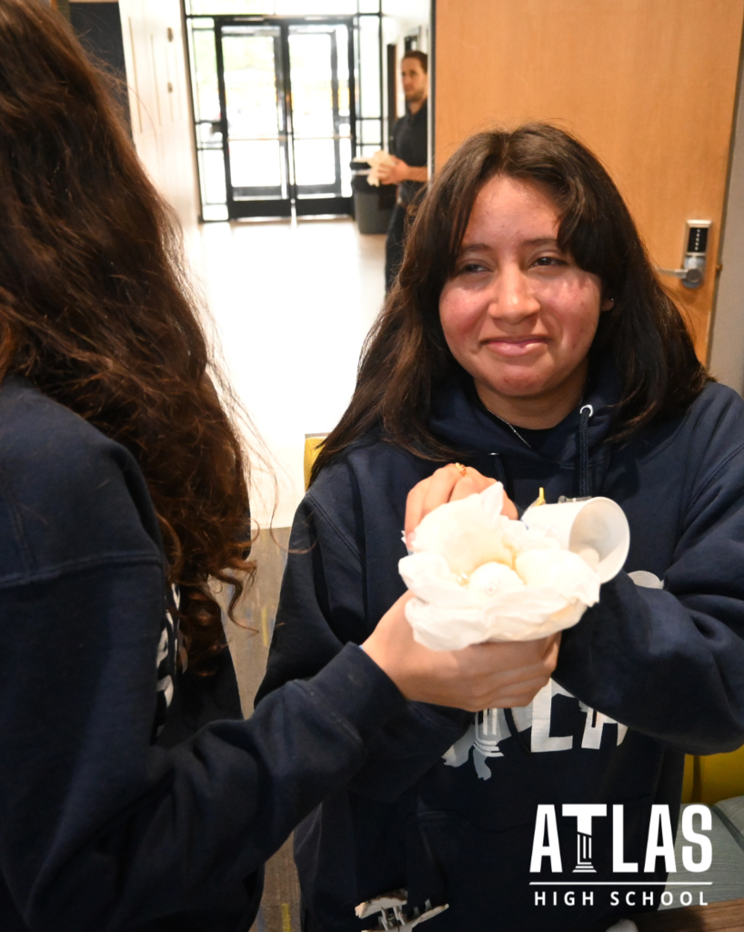 students smile with cracked egg