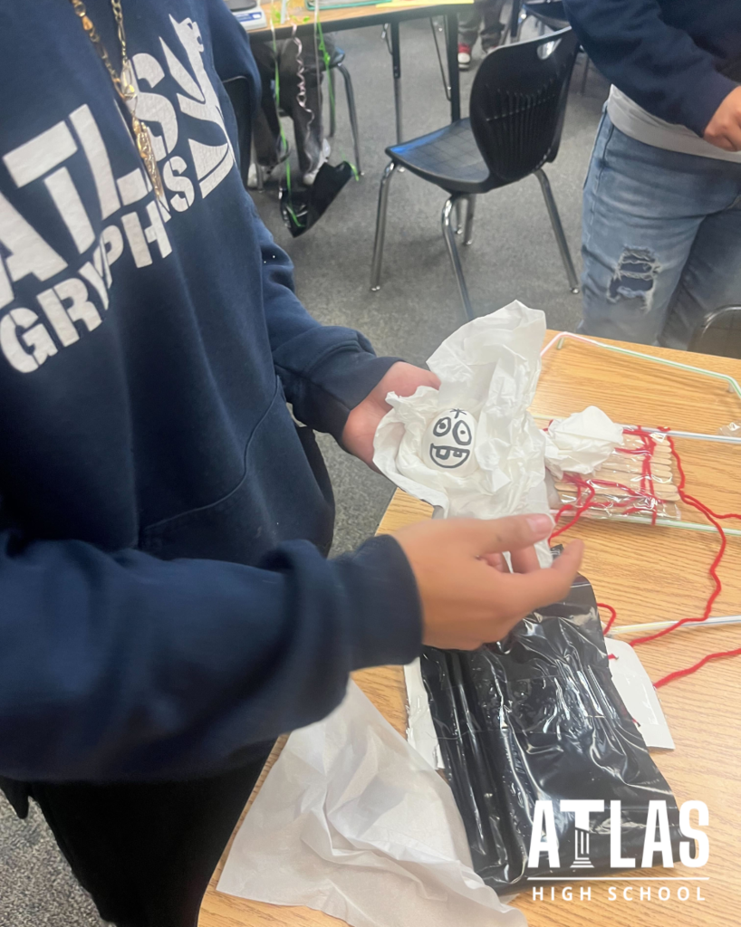 student holds egg