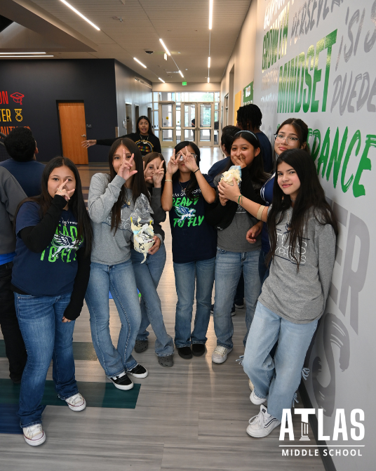 students smile in hallway