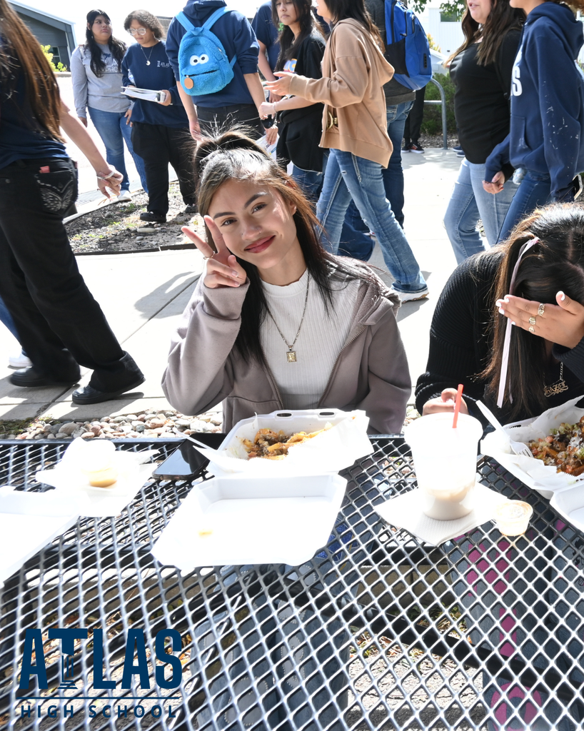 student smiles with food