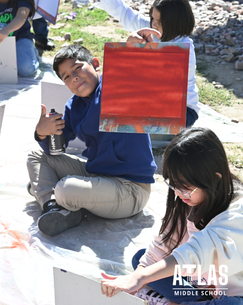 student uses spray paint