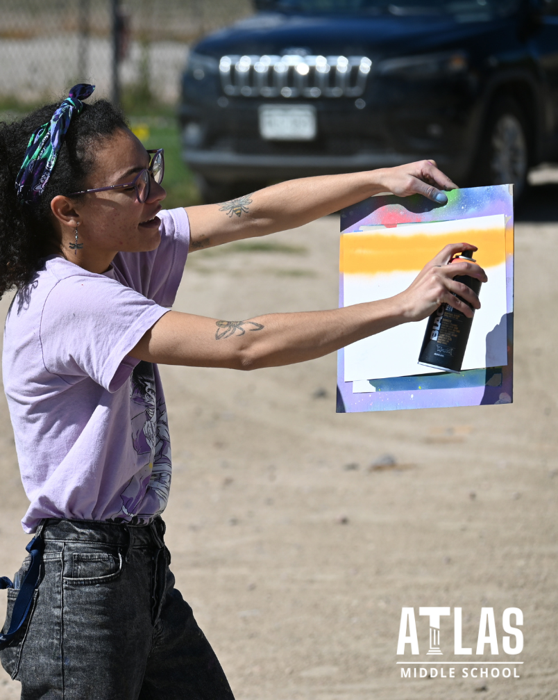 teacher uses spray paint