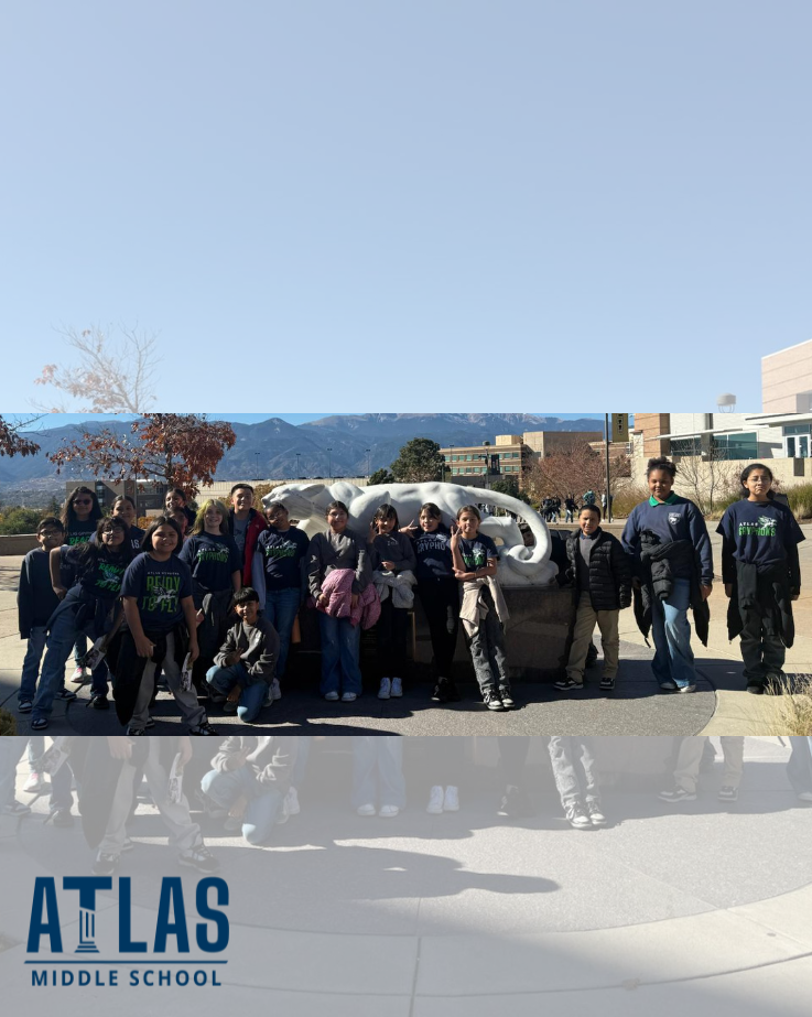 students smile at UCCS with mountains in background
