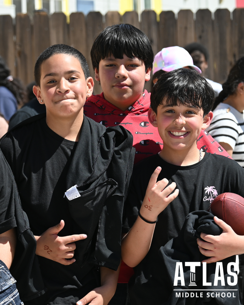 three students smile