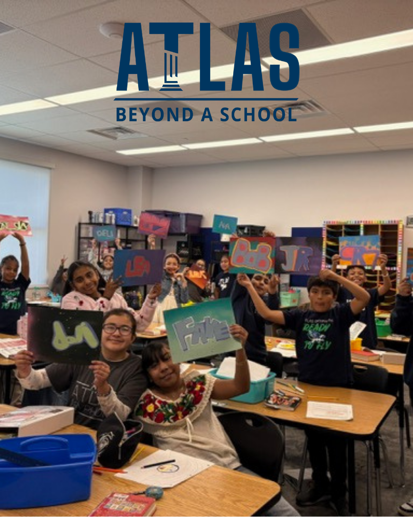 students hold up spray paint art