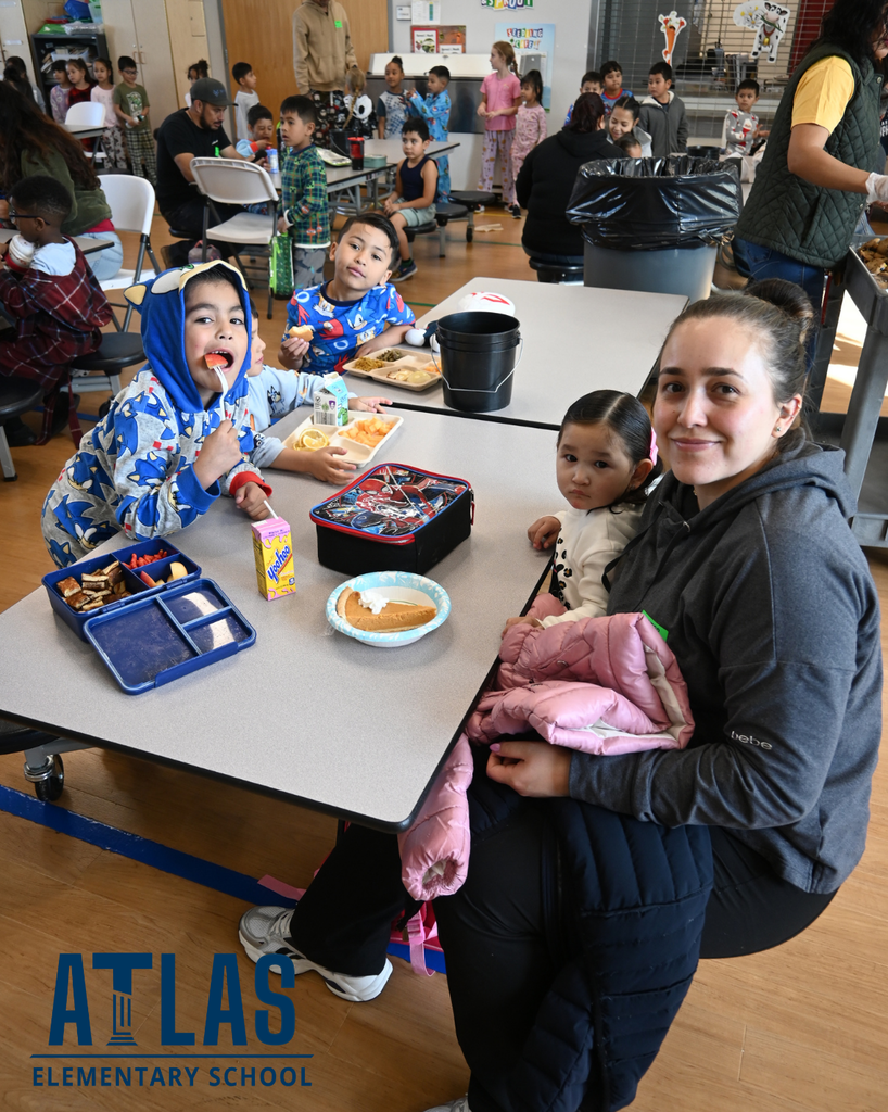 families enjoying pie with their students