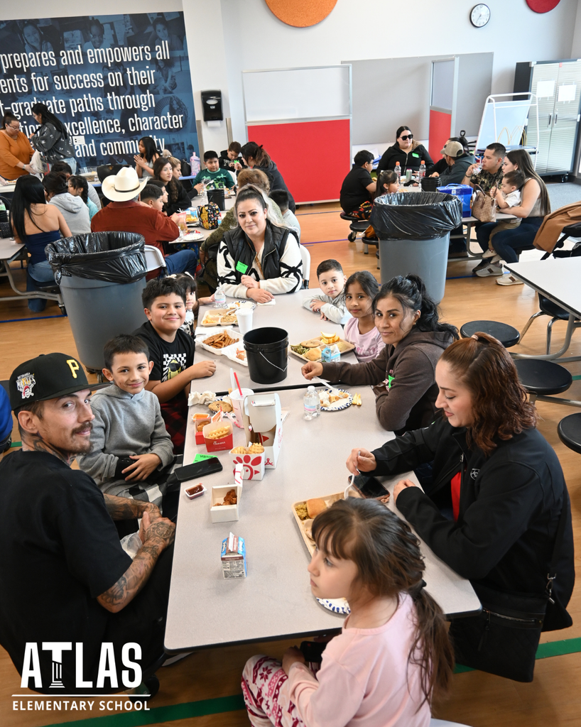 families enjoying pie with their students