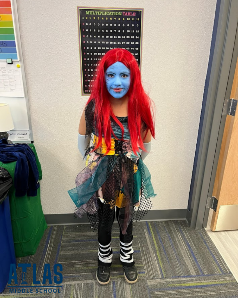 student smiles in costume